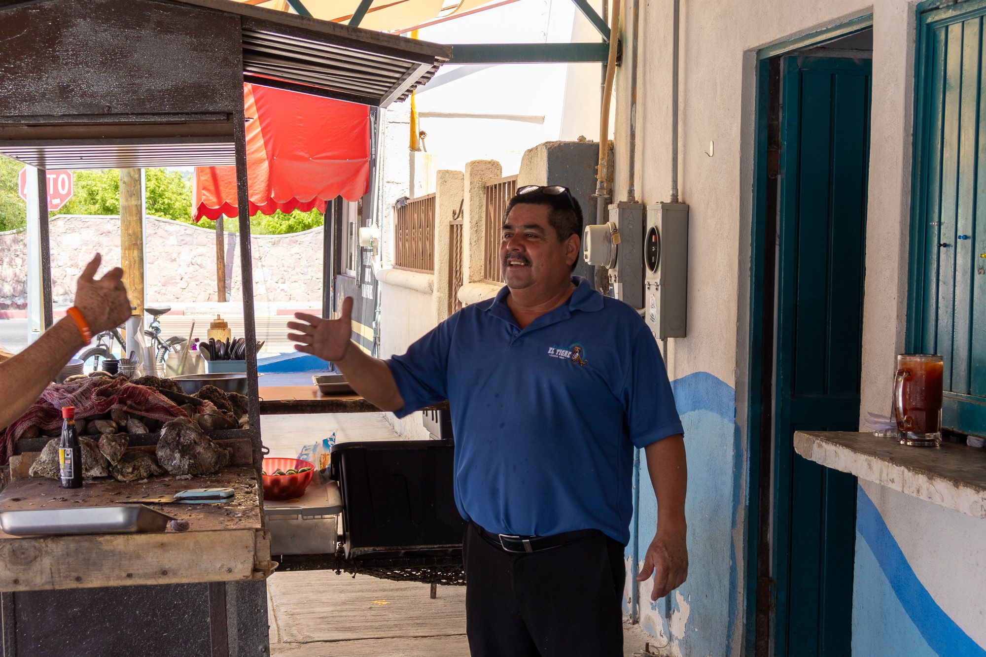 El Tigre owner greeting customers.