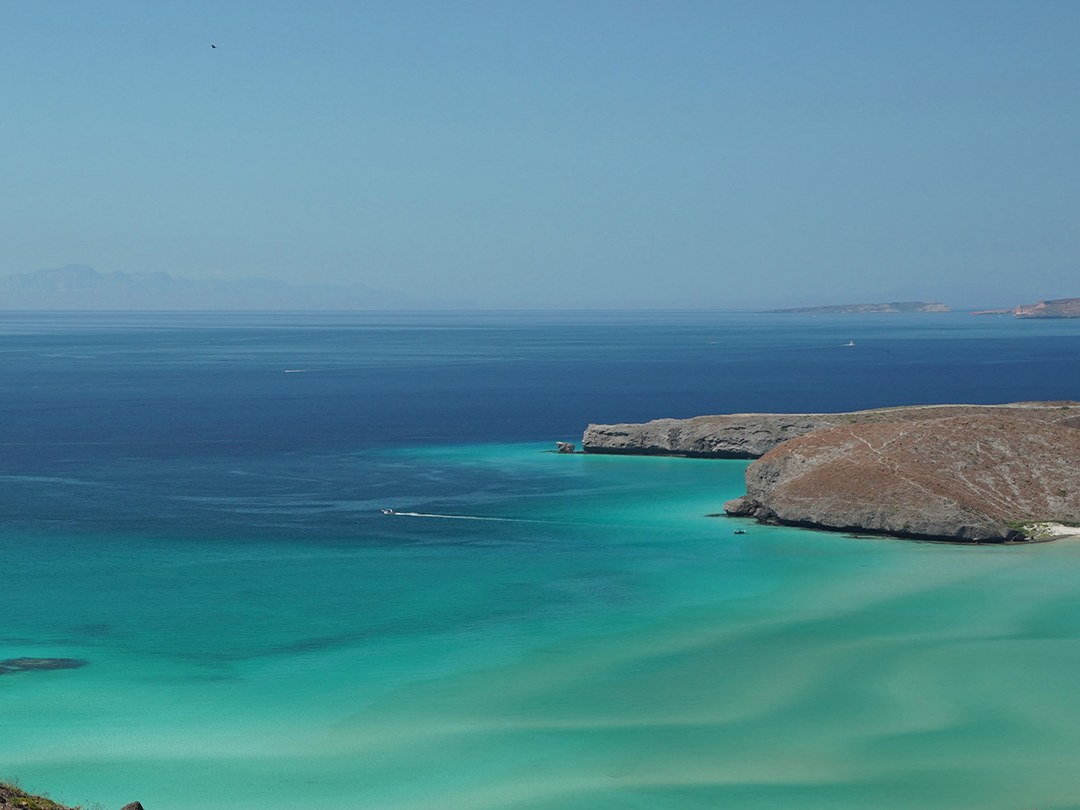 Clear turquoise water and desert coastline at Balandra
